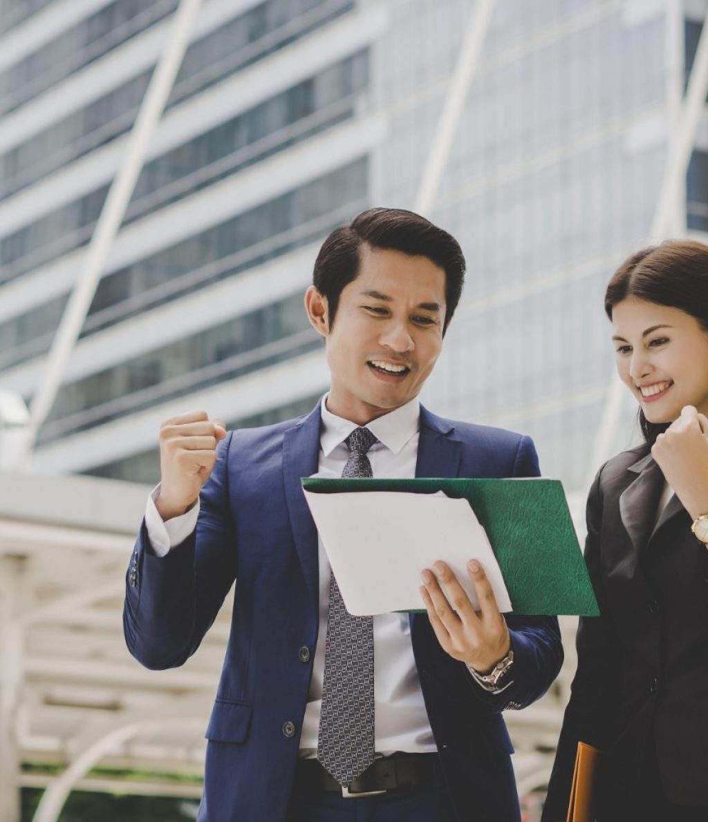 business-colleague-talking-viewing-documents-outdoor+(1)